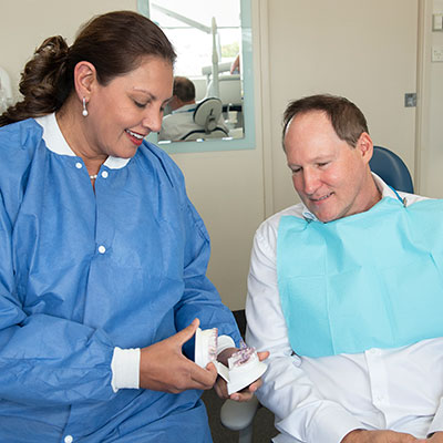 Dr Zabin in treatment with a patient at Maple Dental